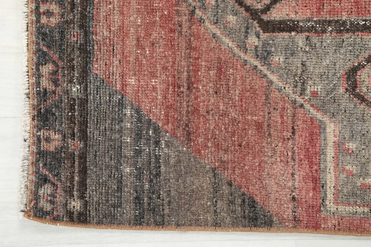 Detailed view of the edge and the subtle color transitions in the border area of the rug