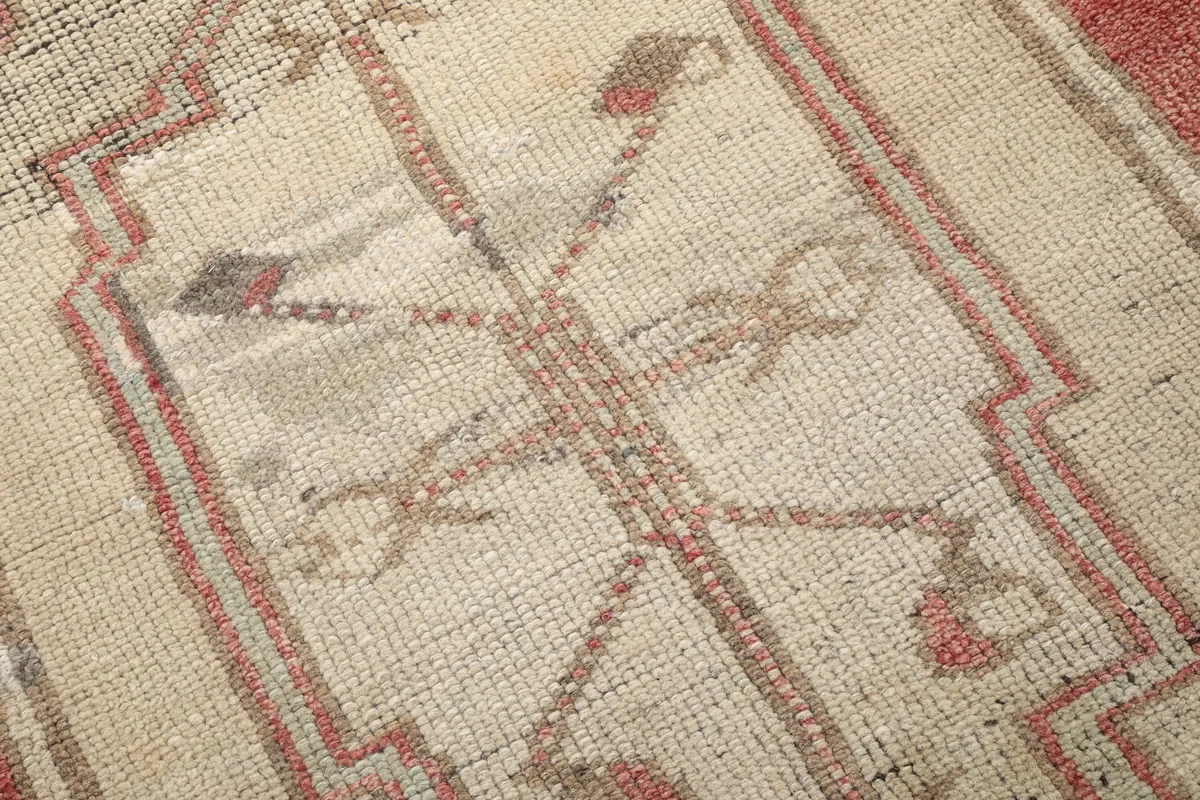 Close-up of the low pile and intricate knotting of the Rust Medallion Anatolian Area Rug's medallion.