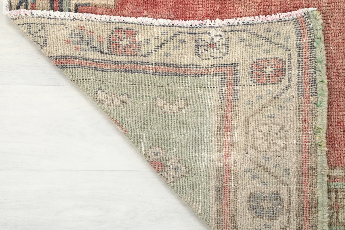 Underside view of the Rust Medallion Anatolian Area Rug, revealing the hand-knotted cotton foundation.