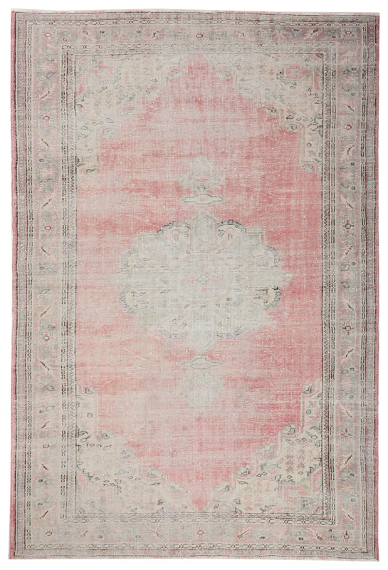 Full top view of the 7x10 rose and gray vintage Anatolian area rug with a central medallion.