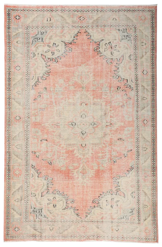 Full top view of the vintage rose and ivory Anatolian area rug on a white background