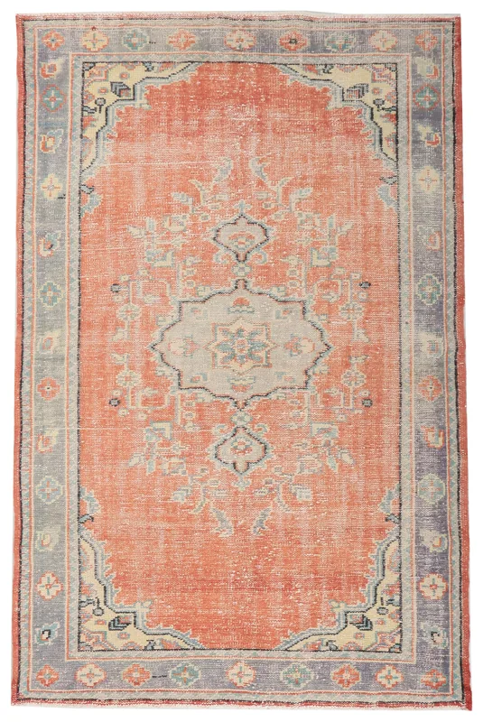 Full overhead view of the hand-knotted vintage Anatolian rug with a rust field and central medallion.