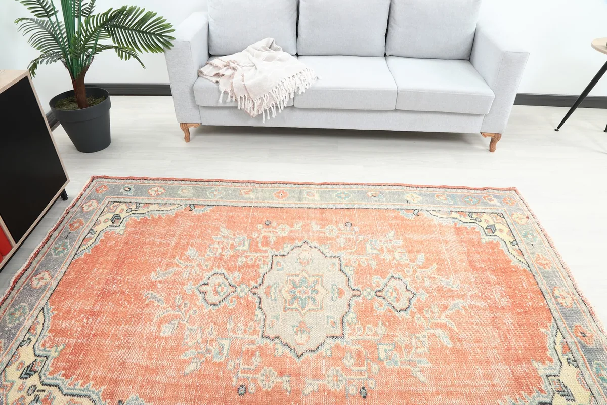 Overhead view showing the rug's full design and colors within a room.