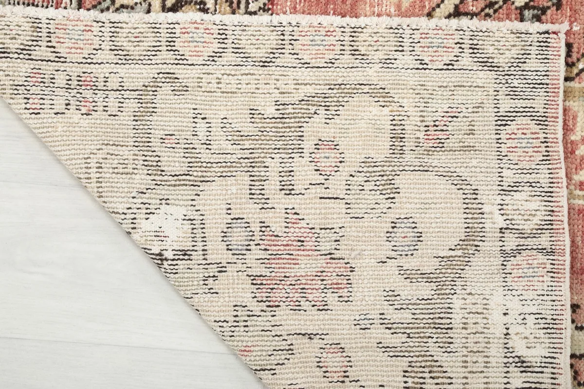 Close-up of the rug's reverse side, showing the dense knotting and craftsmanship