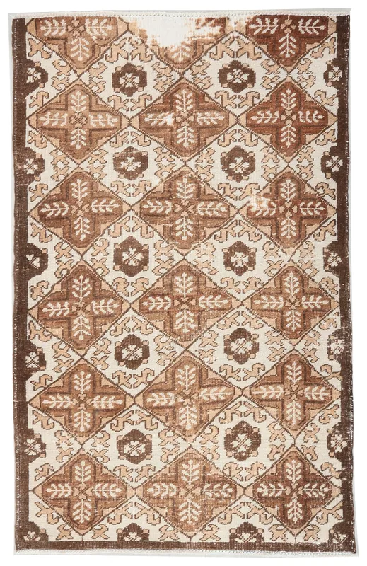 Full top view of the 3'3" x 5'0" brown and ivory geometric vintage Anatolian rug