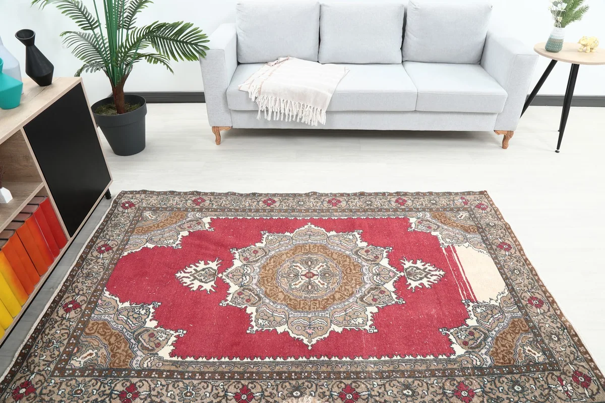 Overhead view of the red vintage rug in a living space, highlighting its size and design