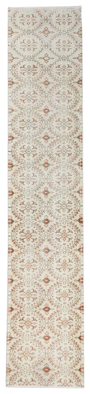 Full overhead view of the 2'6" x 12'9" ivory and rust vintage Anatolian runner rug on a white background.