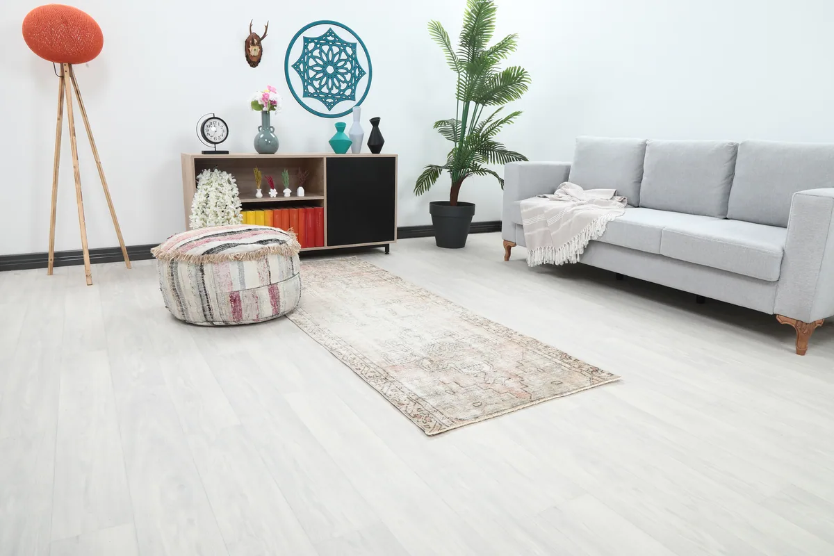 Faded Beige Geometric Medallion Runner in a room setting, showing its length and placement.