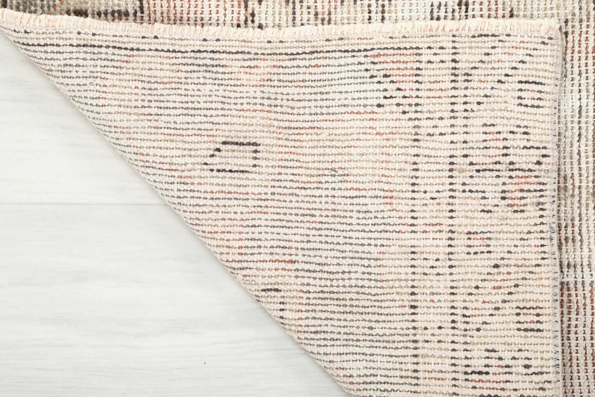 The back of the Faded Beige Geometric Medallion Runner, showing the hand-knotted cotton foundation.