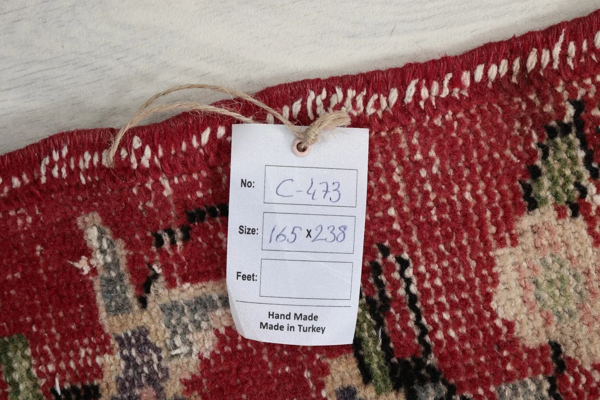 Close-up of the product tag attached to the rug, indicating size and origin