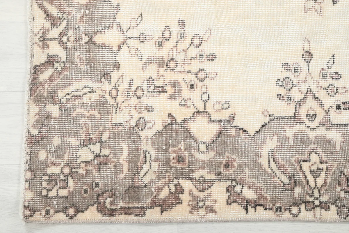 Ivory Gray Medallion Anatolian Rug, detail of the geometric and floral border design.