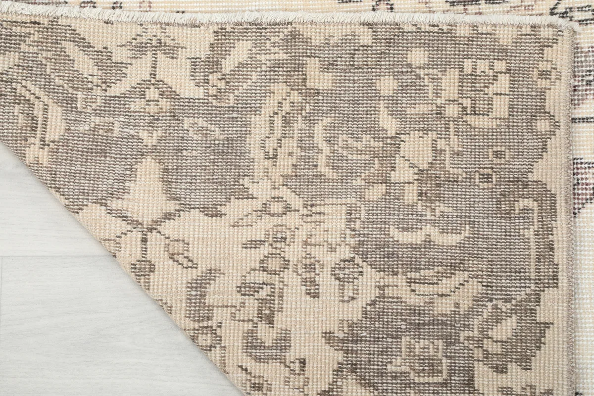 Ivory Gray Medallion Anatolian Rug, close-up of the back of the rug, showing the hand-knotted cotton foundation.