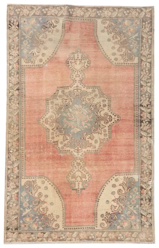 Full top view of the vintage Anatolian area rug with rose field and blue medallion