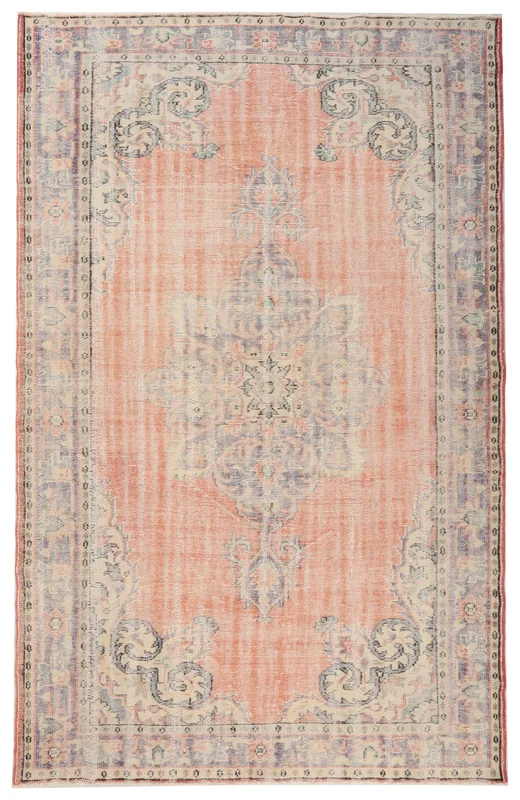 Full overhead view of the rust and blue medallion vintage Anatolian area rug on a white background.