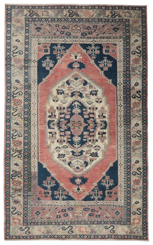 Full top view of a vintage navy and rust Anatolian area rug with a central medallion