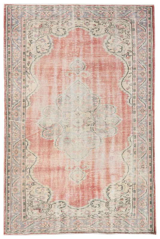 Full overhead view of the 6x9 rose and ivory vintage Anatolian area rug