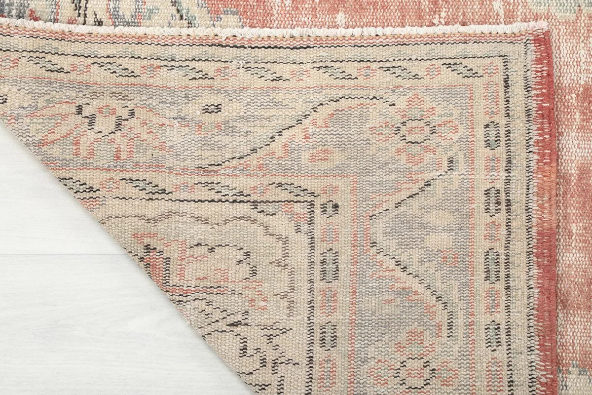 Close-up of the back of the hand-knotted wool rug, revealing the weave