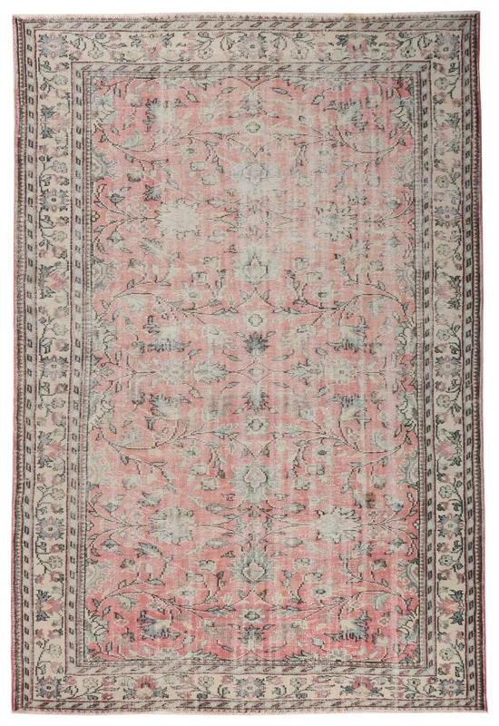 Full overhead view of the 7'0" x 10'6" rose and ivory Anatolian vintage area rug on a white background.