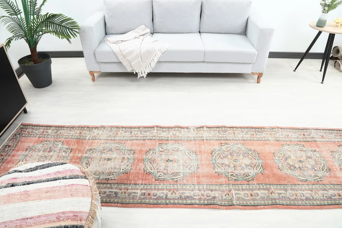 Overhead view of the runner rug in a room, highlighting its placement in front of a sofa