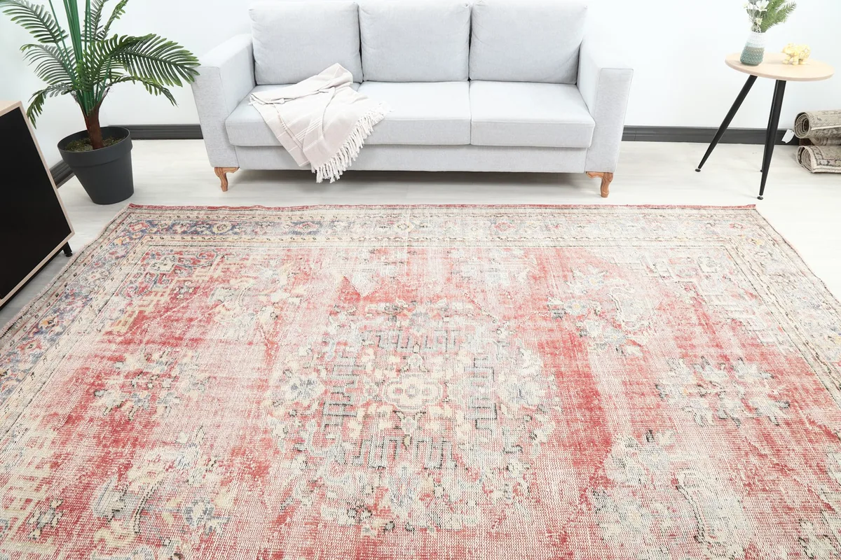 Overhead view of the rug in a living room, highlighting its size relative to furniture
