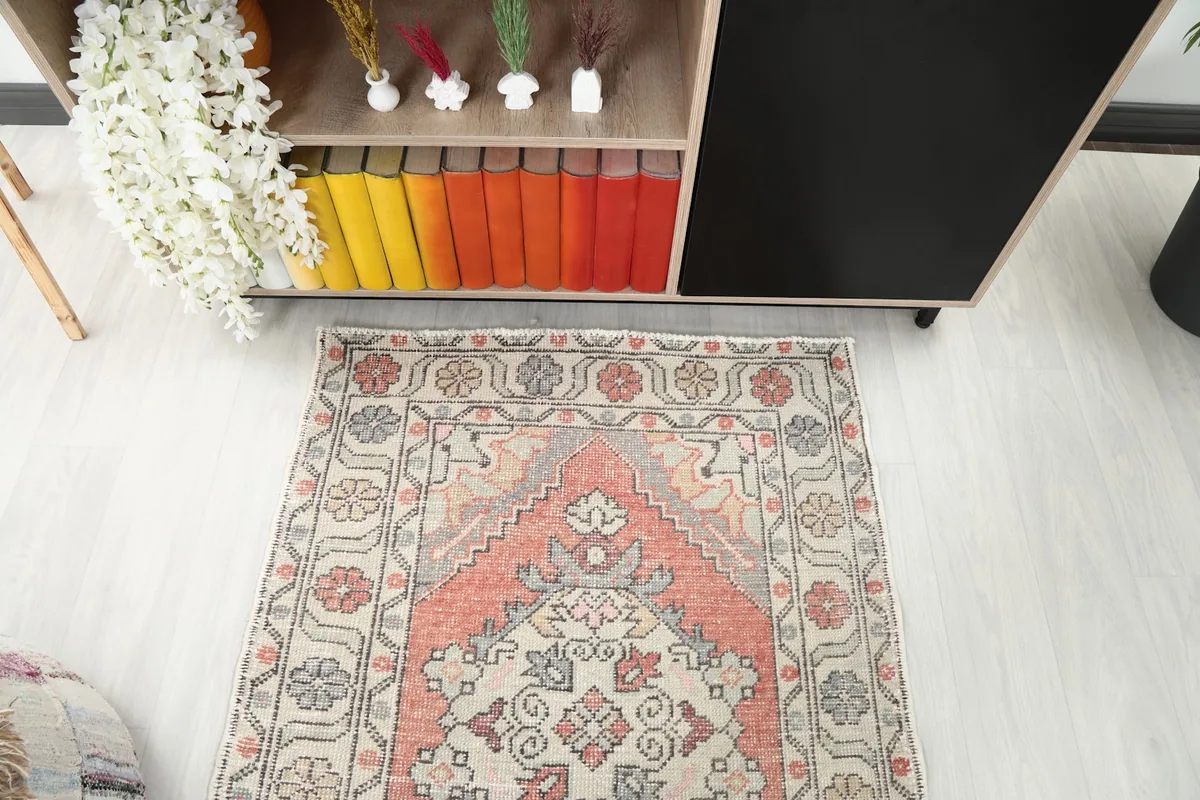 Overhead shot of one end of the runner rug, focusing on the geometric and floral patterns.