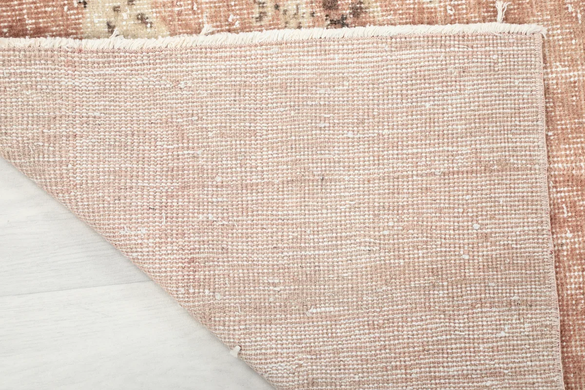 Reverse side of the Faded Rose Floral Anatolian Rug, showing the tight hand-knotted cotton foundation.