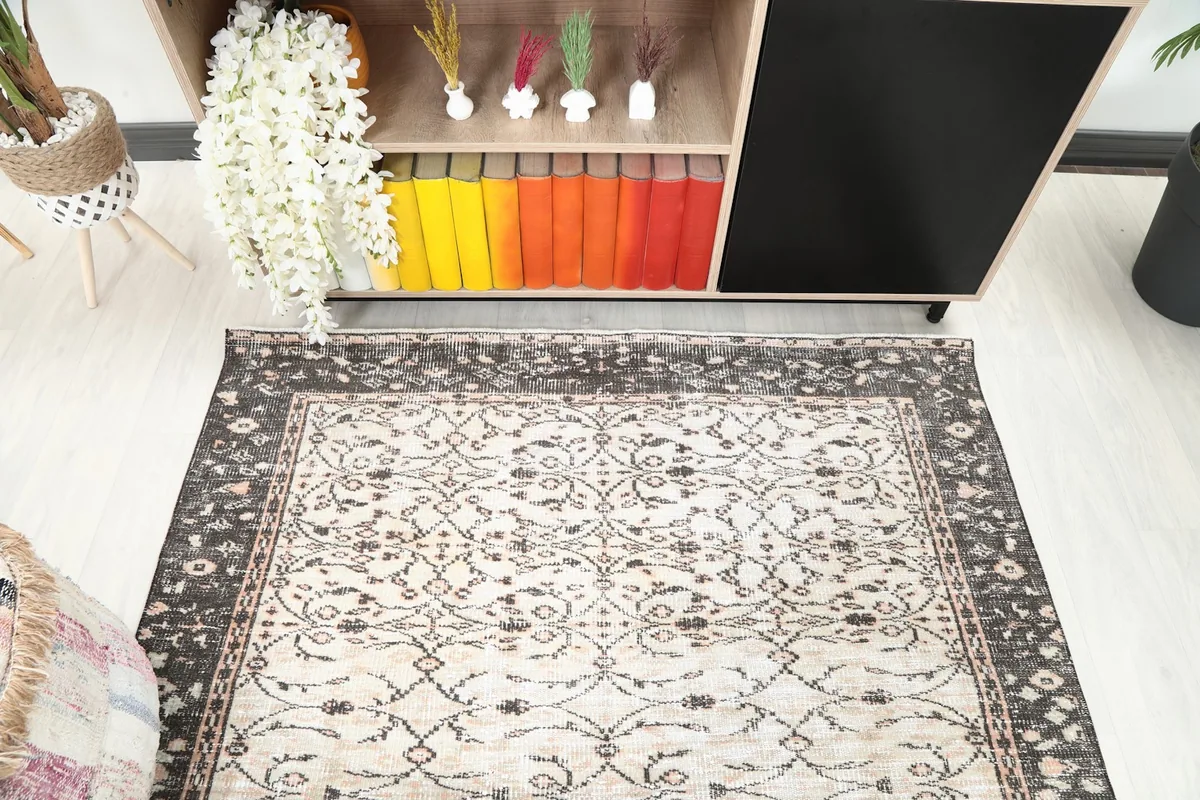 Top-down view of the rug's pattern and colors, highlighting the ivory and charcoal.