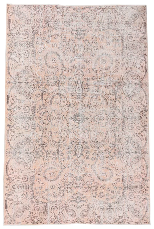 Full top view of the vintage rose and gray floral medallion rug on a white background