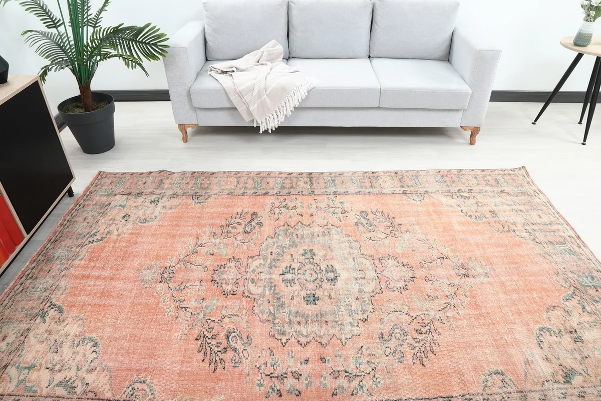 Overhead view of the rug in a room, highlighting the central medallion and colors