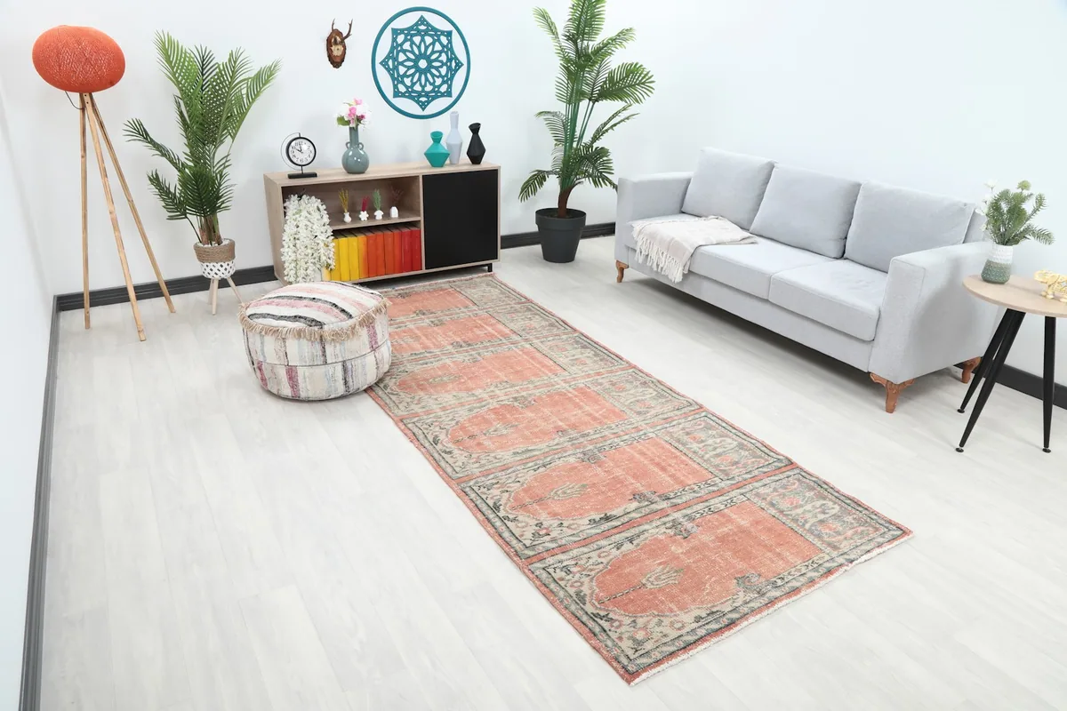 Angle view of the rust runner in a bright living space, showing its length and pattern