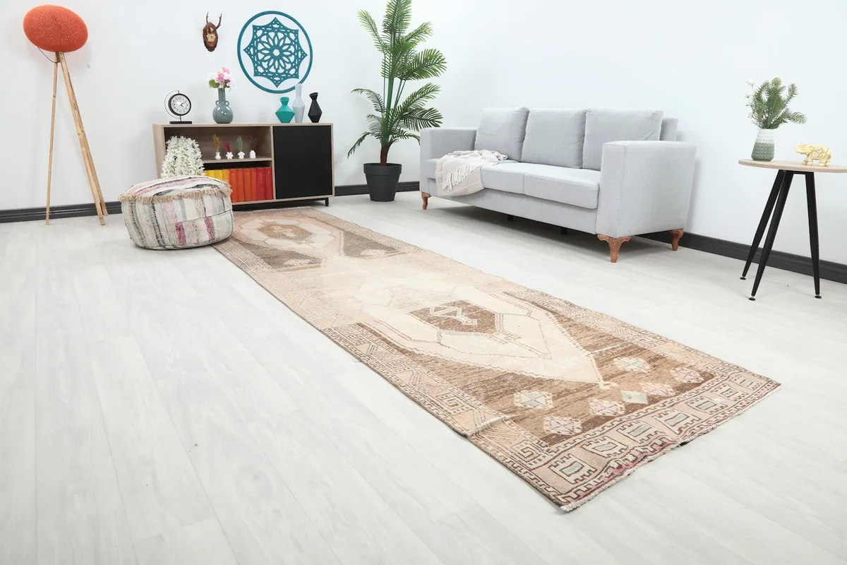 Angle view of the runner rug in a room, highlighting its use in a long space next to a sofa