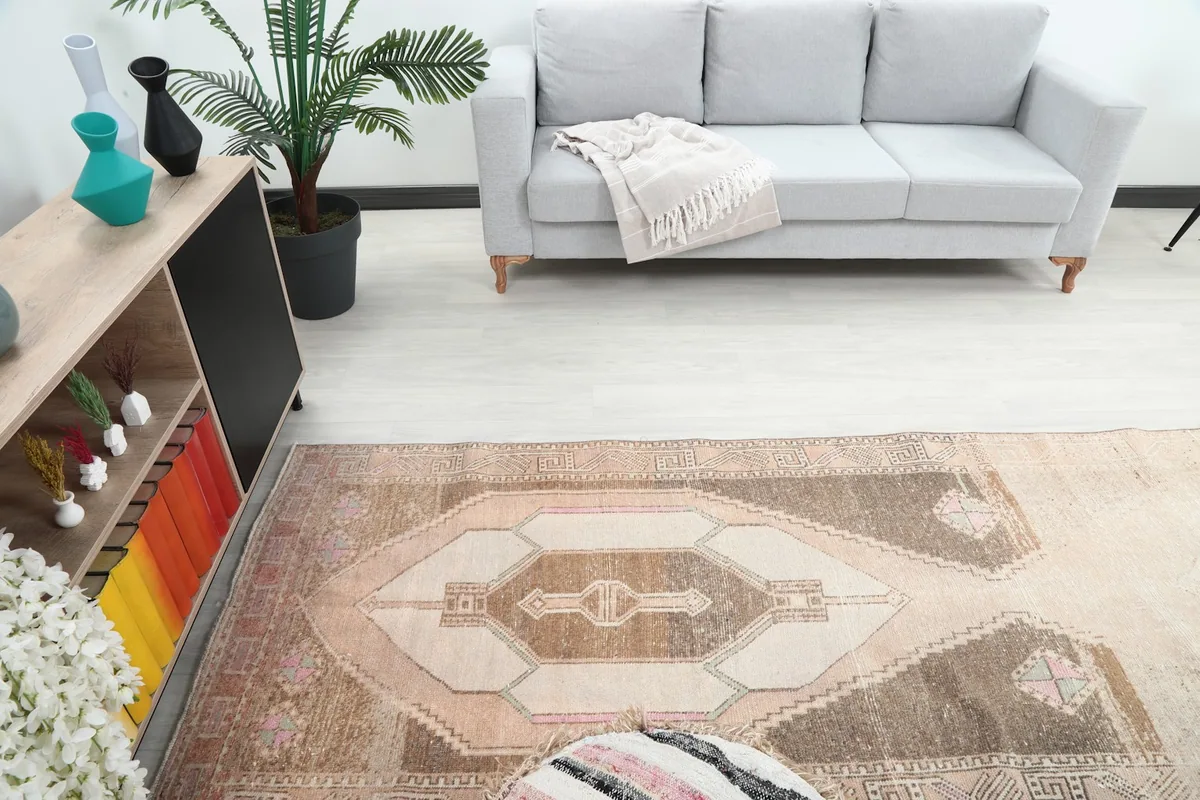 Overhead view of the middle section of the runner rug in a room, capturing its central design and distressed look