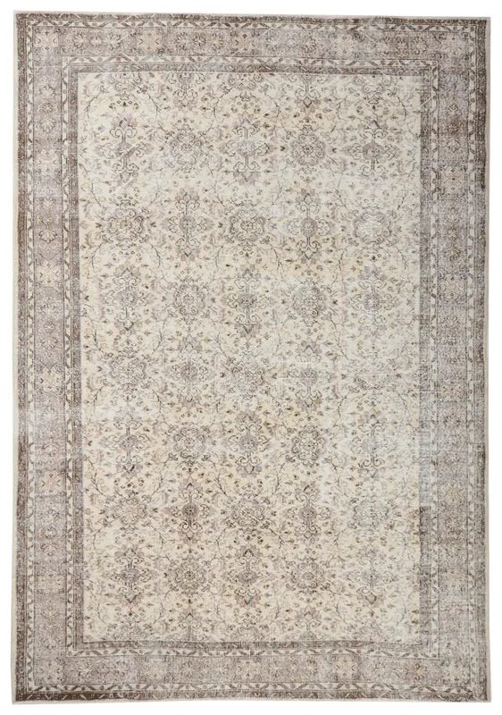 Top view of a large 7'3" x 10'4" ivory and gray floral vintage Anatolian area rug on a white background.