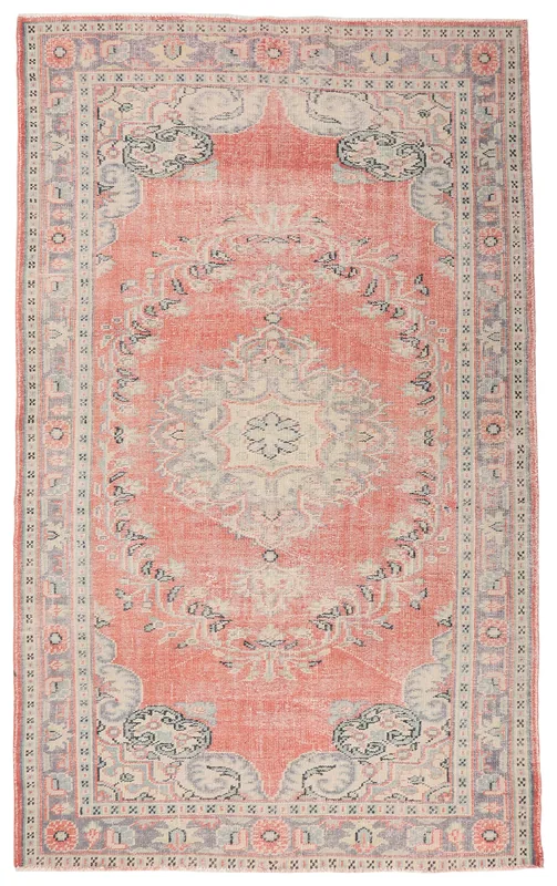 Full top view of a vintage hand-knotted Anatolian rug with a rose field and gray geometric medallion