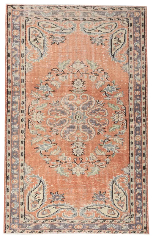 Full top view of a 4x7 vintage Anatolian rug with a rust field and floral medallion pattern.