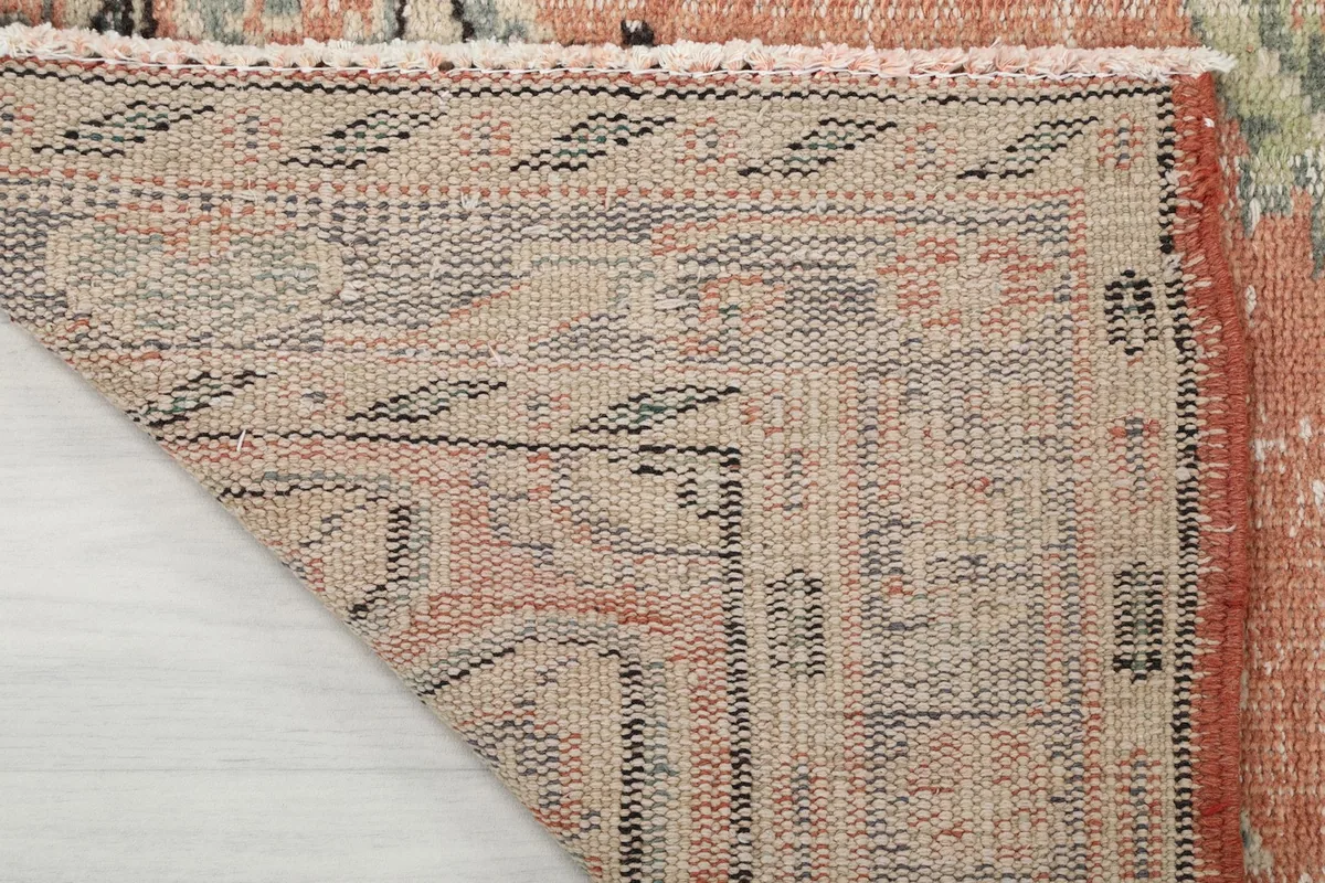 Underside of the rug, showing the cotton foundation and the consistent hand-knotted construction.