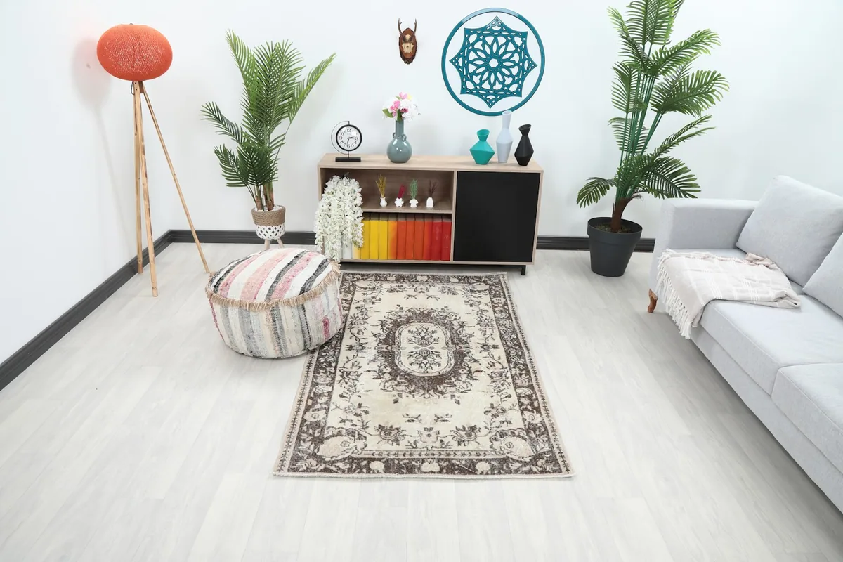 Vintage Anatolian rug placed in a modern living room setting, showing its scale and color harmony.