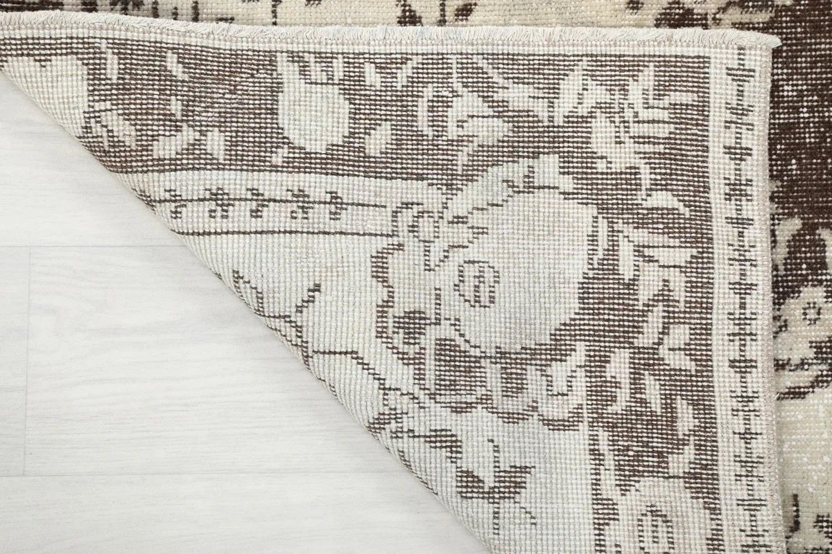 Another perspective of the rug's back, emphasizing the construction and fringe details.