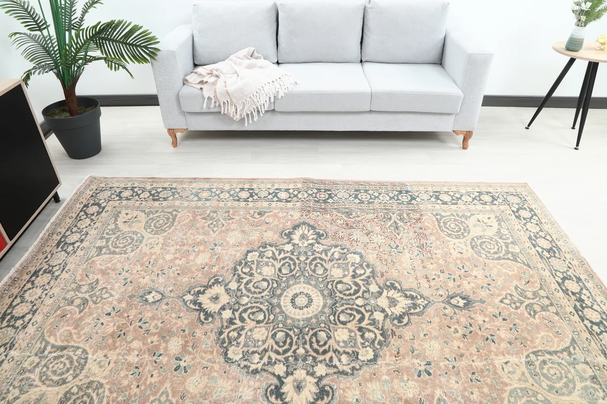 Overhead view of the Faded Rust Medallion Anatolian Rug in a room, capturing the full design and muted color palette.