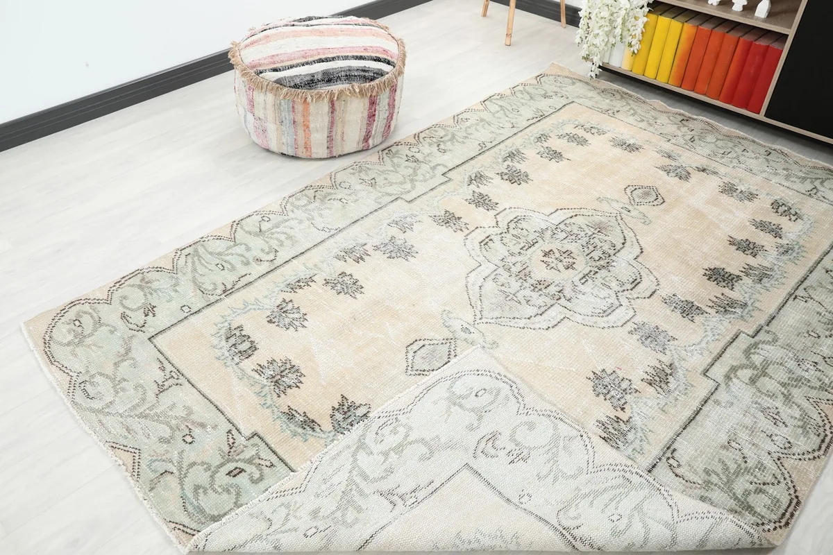 The rug partially folded to show the texture and slight variations in color.