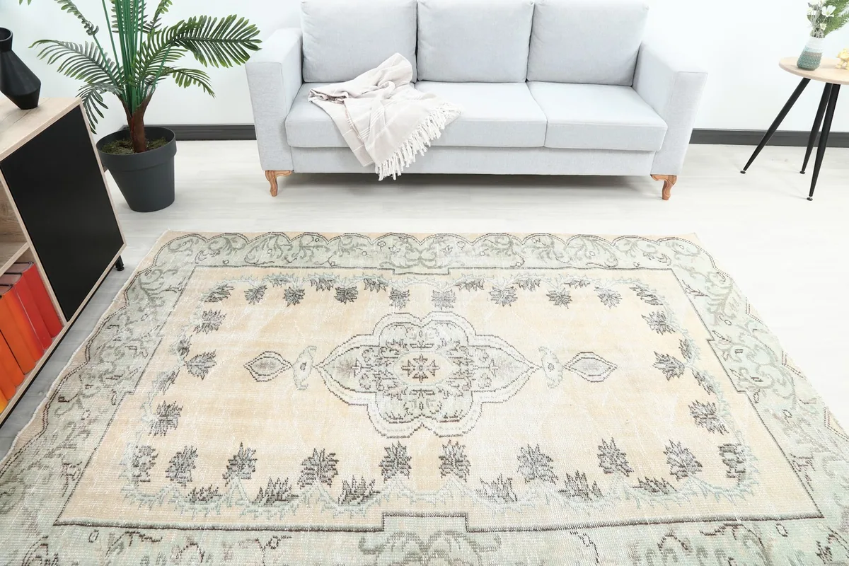 Overhead view of the rug in a room, capturing its full design and surrounding decor.