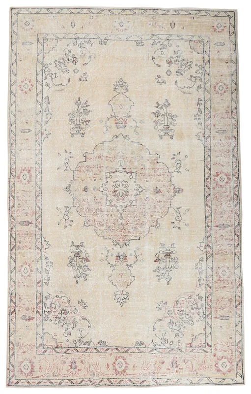 Full overhead view of the 6x10 vintage Anatolian area rug with an ivory field and rose medallion
