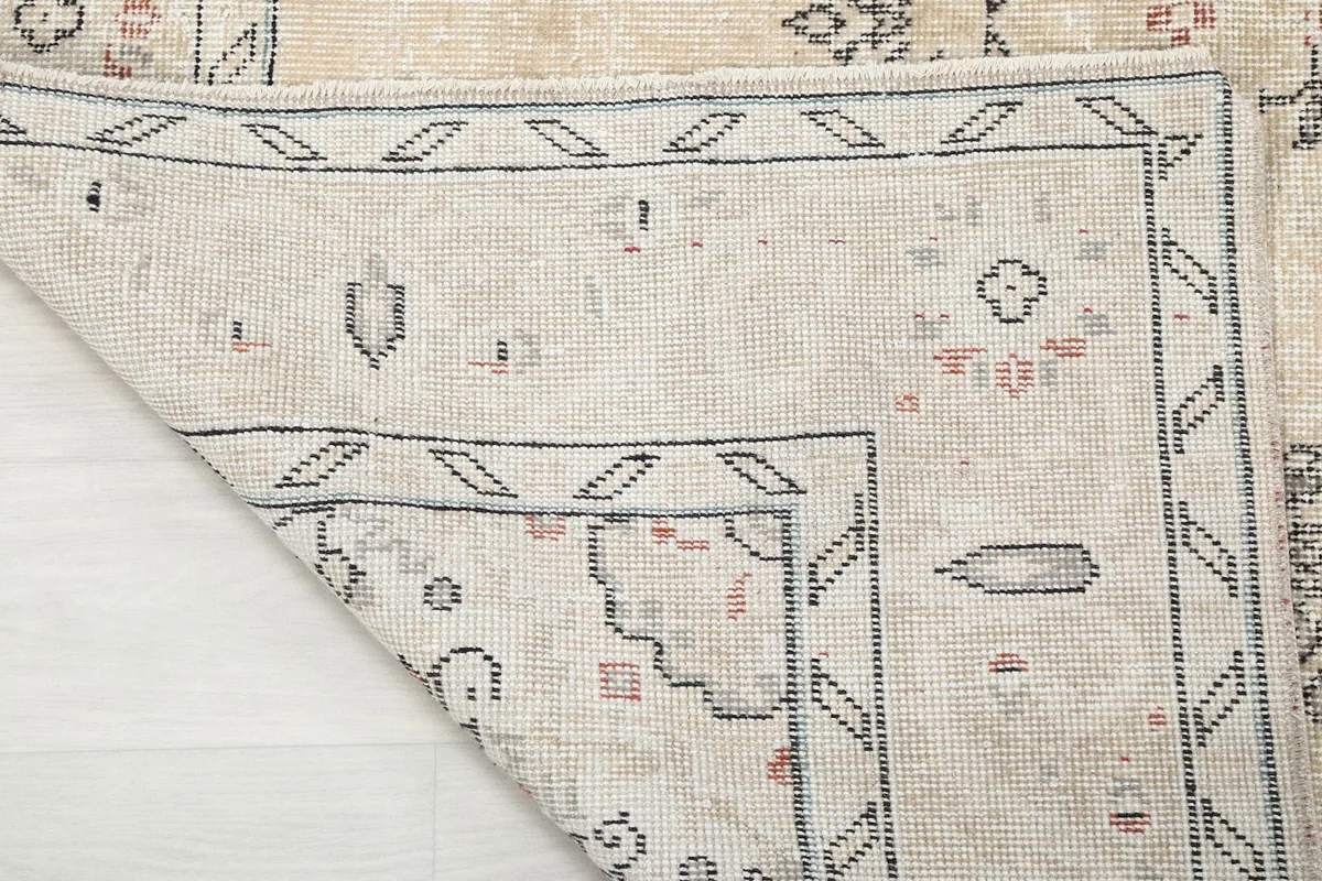 Underside view of the hand-knotted cotton foundation and knotting detail