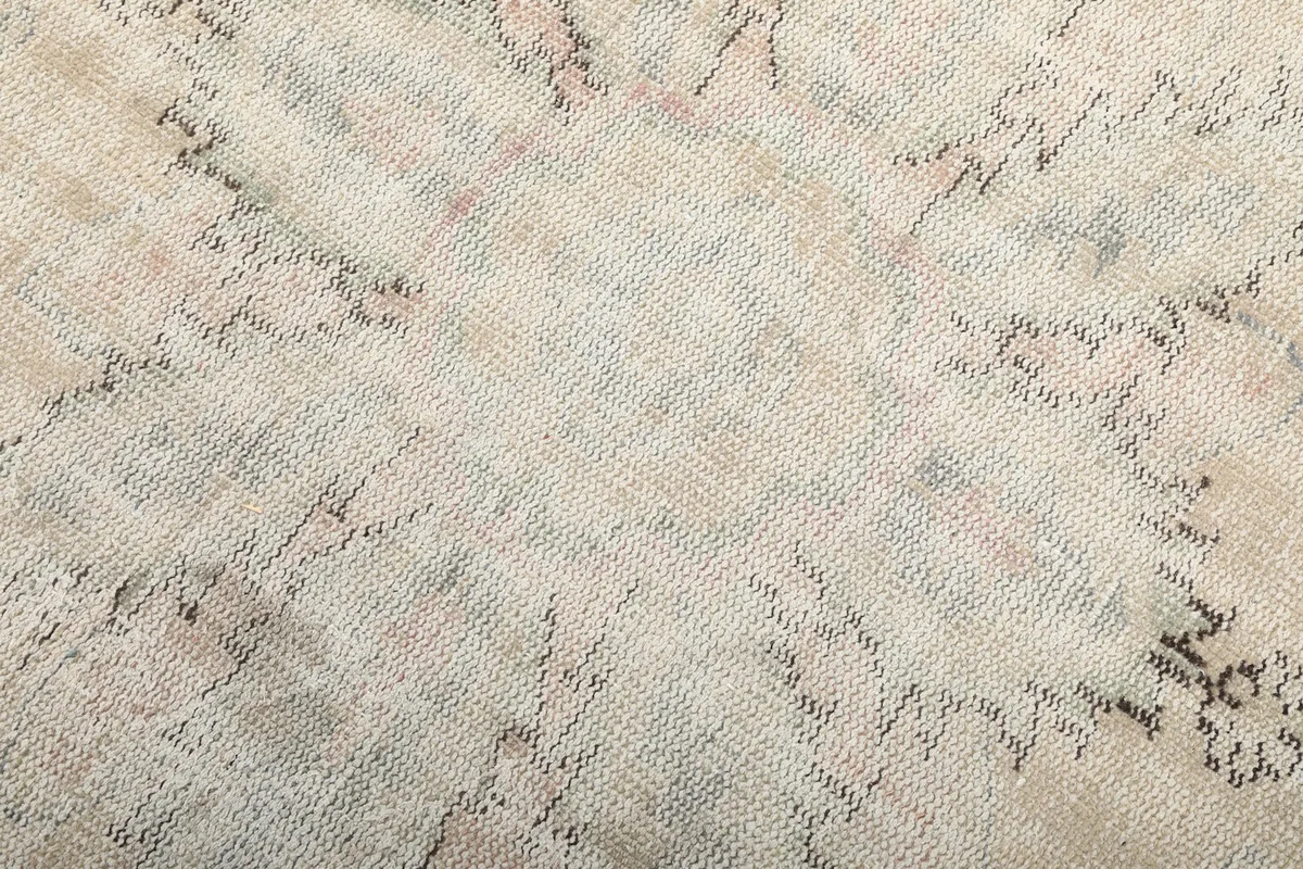 Detailed view of the hand-knotted wool pile, showing texture and color variations