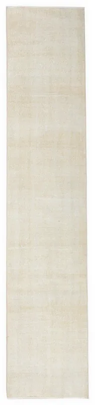 Full top view of the 2'4" x 11'0" hand-knotted cream vintage Anatolian runner rug on a white background.