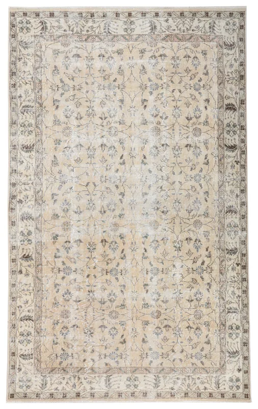 Full top view of the 5'3" x 8'6" ivory and gray floral vintage Anatolian rug