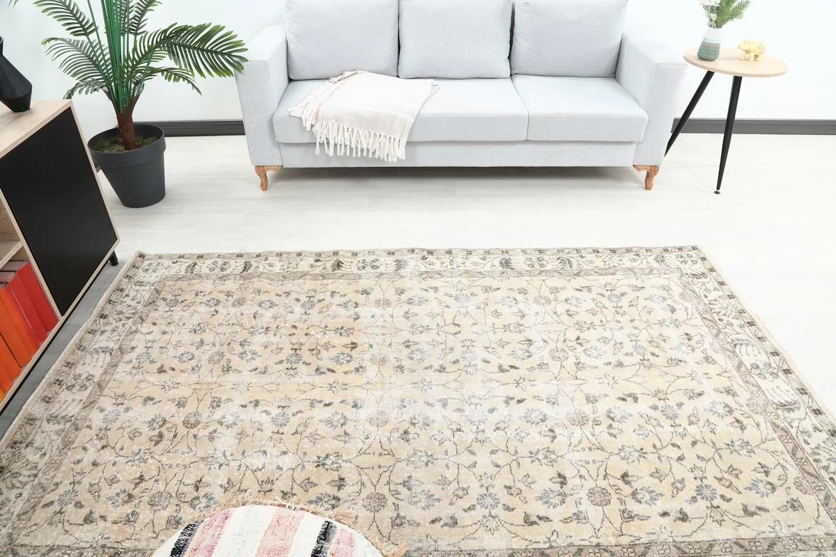 Overhead view of the rug placed in a room, highlighting its medium size and design