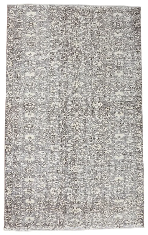 Full overhead view of the gray and ivory vintage Anatolian area rug with floral motifs