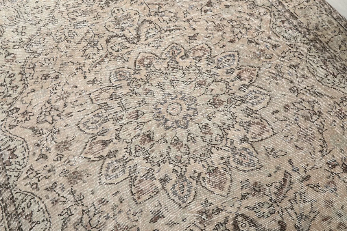 Detailed close-up of the central medallion, highlighting the gray and cream tones