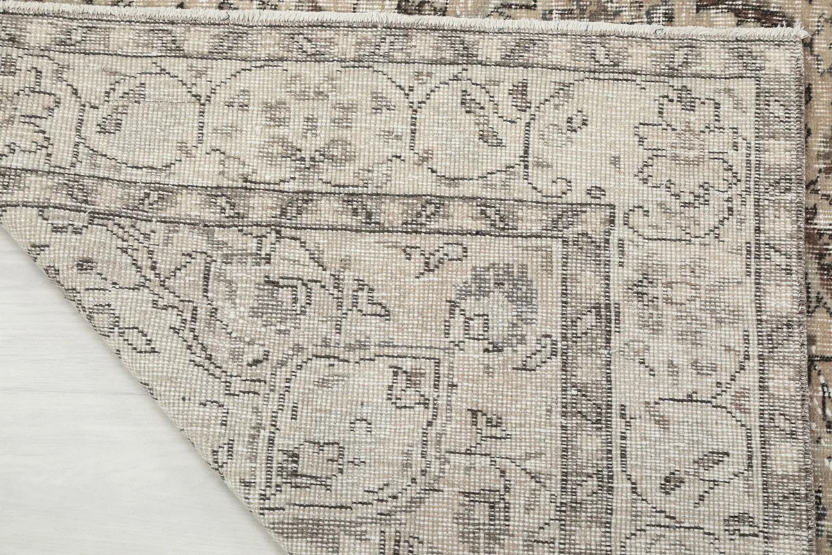 Detail of the rug's underside and construction, with the corner folded back